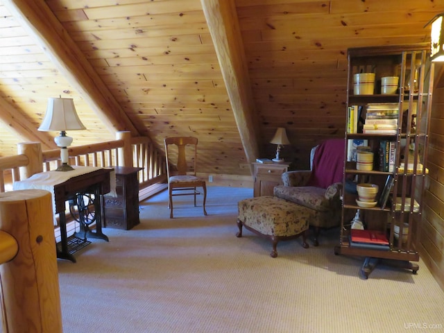 sitting room with wood walls, carpet floors, and wooden ceiling