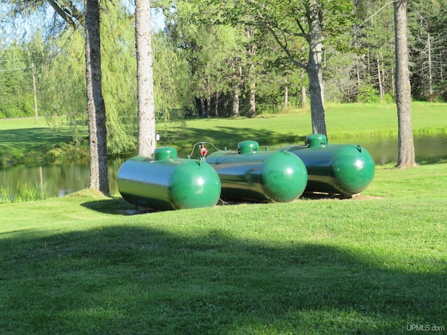 exterior space with a lawn and a water view