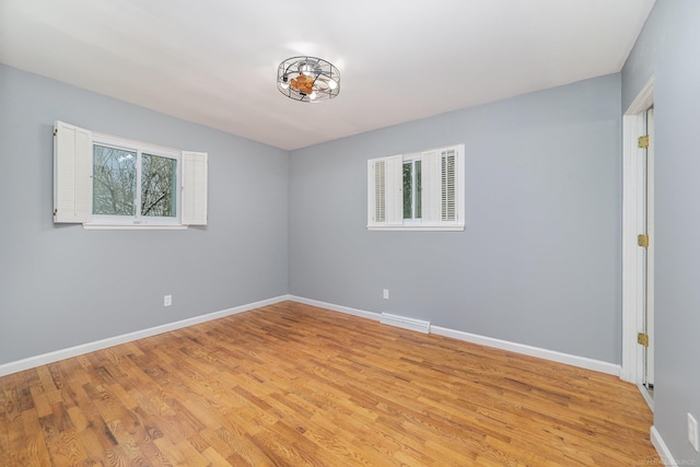 unfurnished room featuring light wood-type flooring