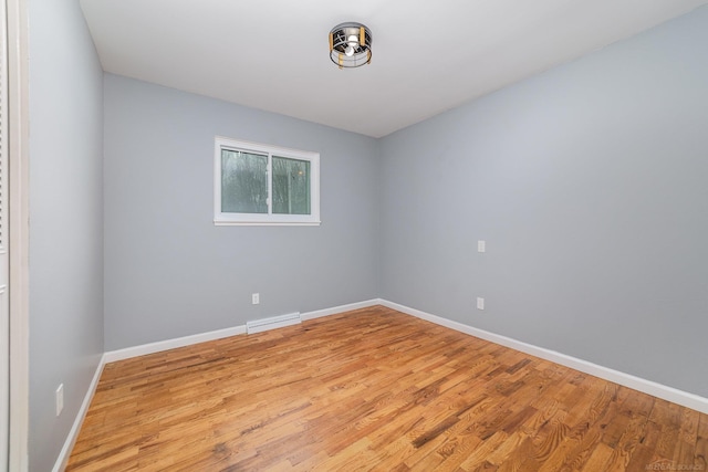 spare room with light hardwood / wood-style flooring