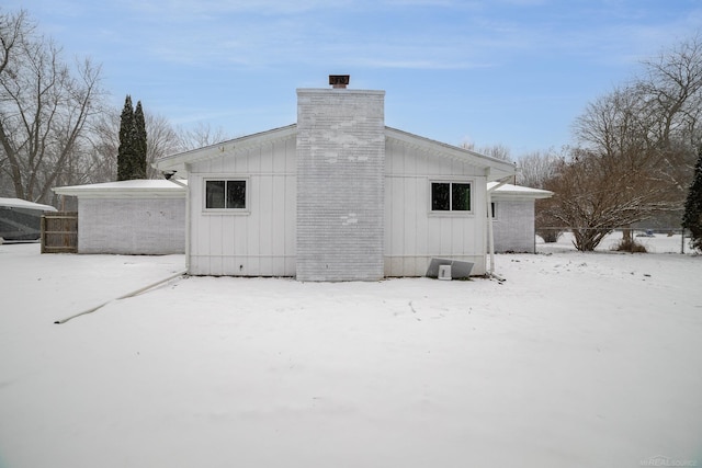 view of snow covered house