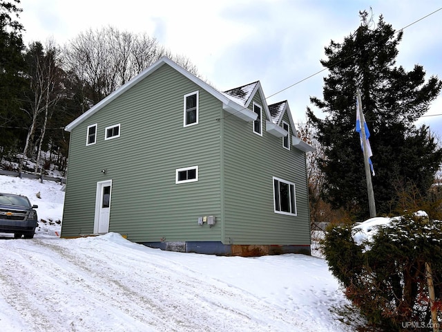 view of snow covered house