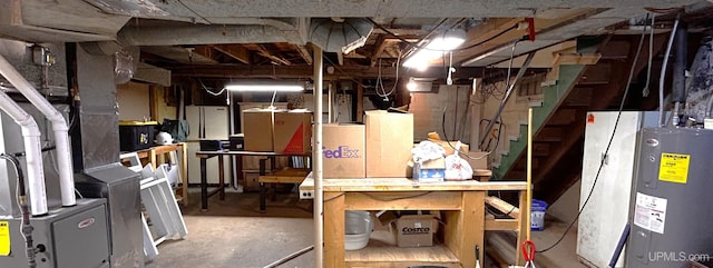 basement with a workshop area and electric water heater