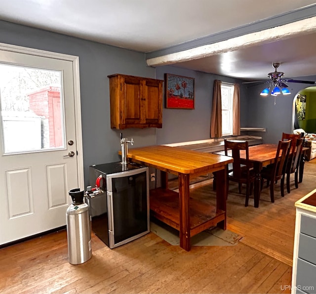 dining space featuring ceiling fan and light wood-type flooring