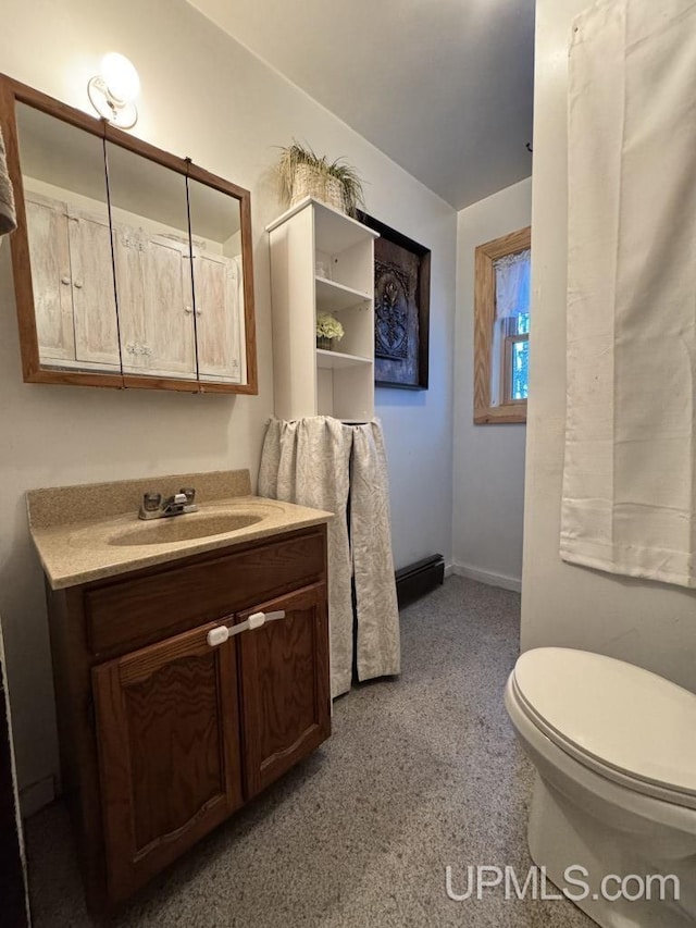 bathroom featuring vanity and toilet