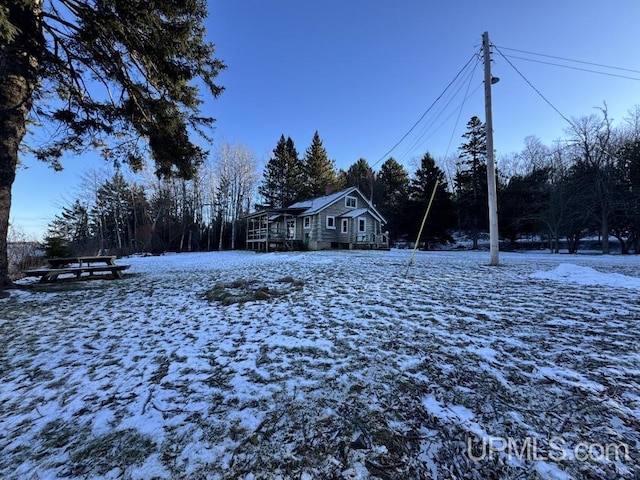 view of yard covered in snow