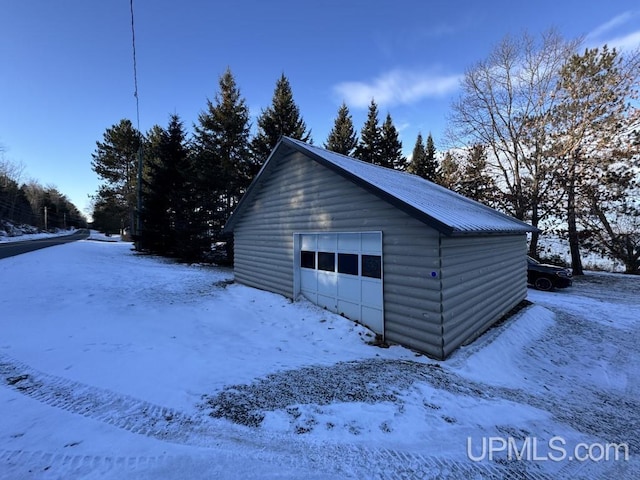 view of snow covered garage