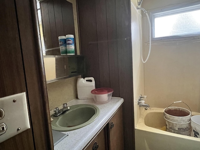 bathroom with vanity and shower / bath combination