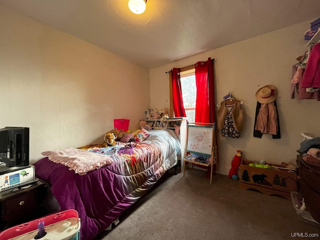 bedroom featuring carpet