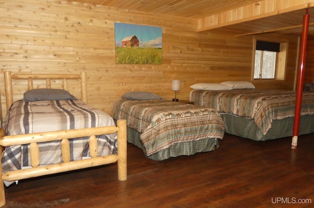 bedroom with wood walls, wooden ceiling, and hardwood / wood-style floors