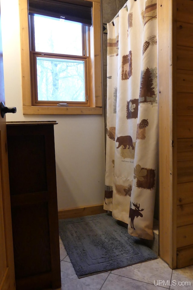 bathroom featuring tile patterned flooring