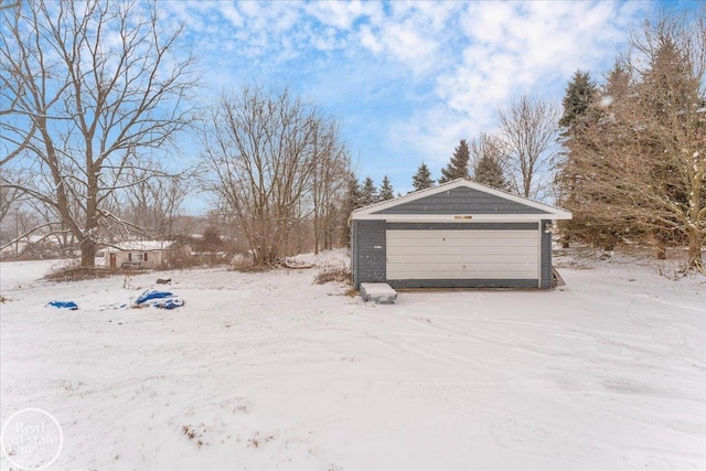 view of snow covered garage