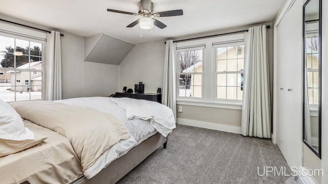 bedroom featuring carpet floors, a closet, ceiling fan, and lofted ceiling