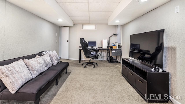 office space with light carpet and a drop ceiling