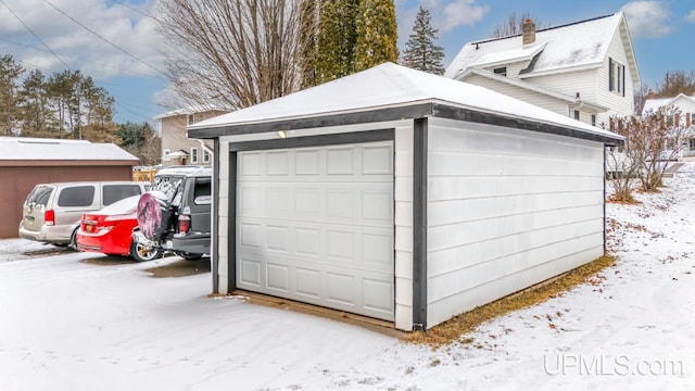 view of snow covered garage