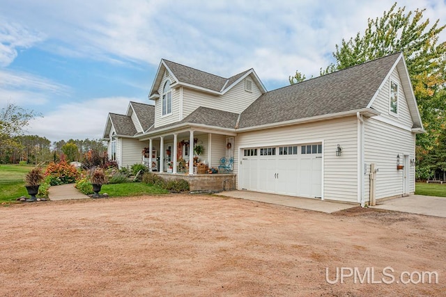 front facade with a porch and a garage