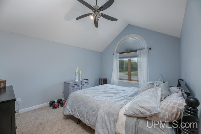 carpeted bedroom featuring ceiling fan and vaulted ceiling