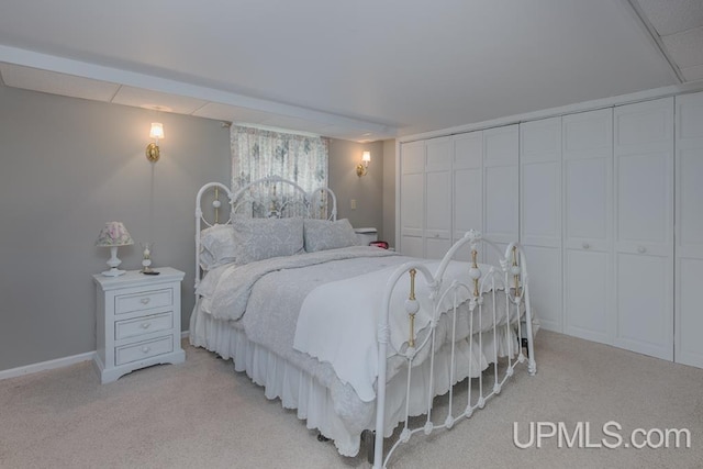 carpeted bedroom with a closet