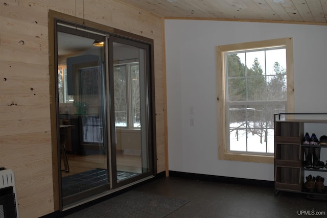 doorway with lofted ceiling, wood ceiling, wooden walls, and heating unit