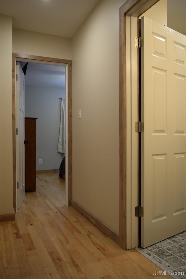 corridor featuring light hardwood / wood-style floors