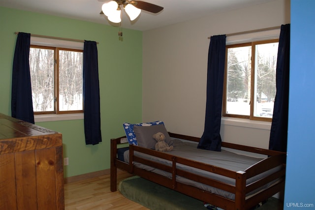 bedroom featuring light hardwood / wood-style flooring and ceiling fan