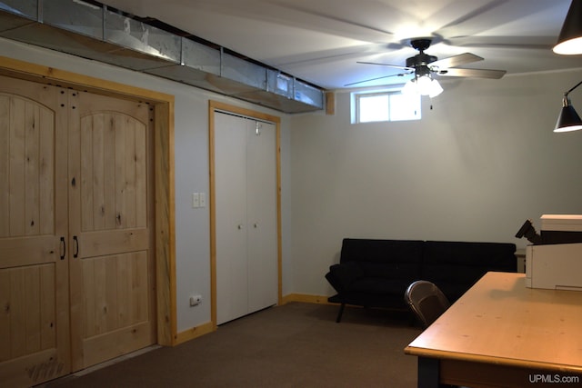 carpeted home office with ceiling fan