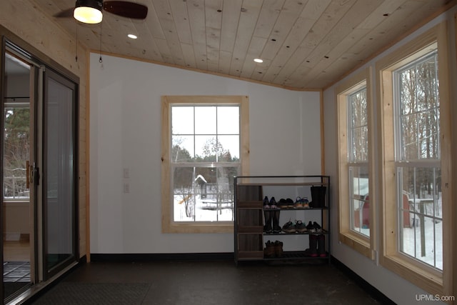 interior space with ceiling fan, wooden ceiling, and vaulted ceiling