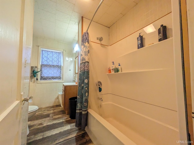 full bathroom featuring shower / bath combo, toilet, wood-type flooring, and sink