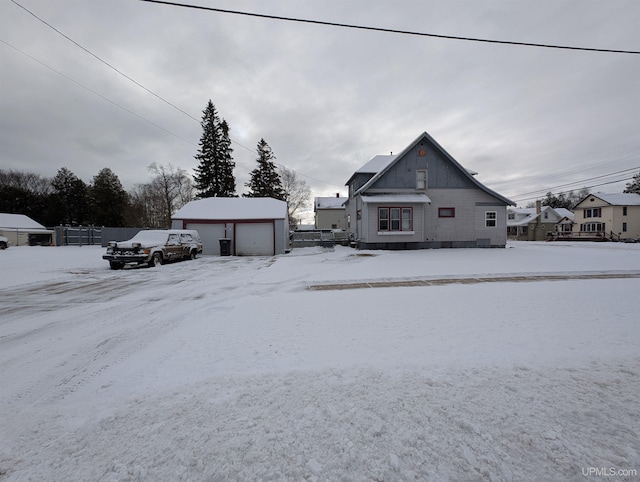 view of front facade with an outbuilding and a garage