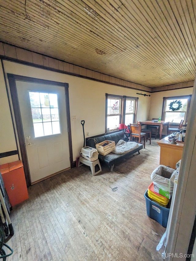 living room featuring wood ceiling and hardwood / wood-style flooring