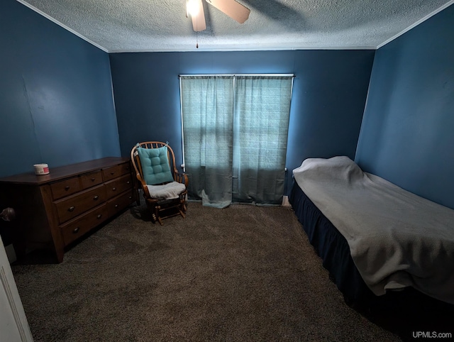 bedroom featuring ceiling fan, carpet floors, and a textured ceiling