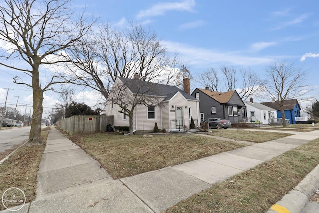 bungalow-style house featuring a front yard