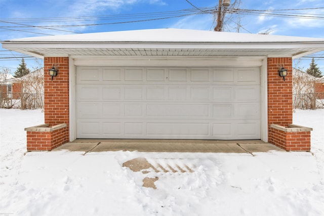 view of snow covered garage