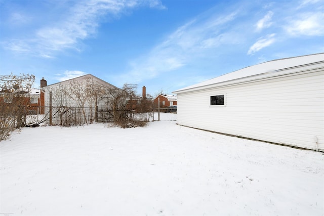 view of yard covered in snow