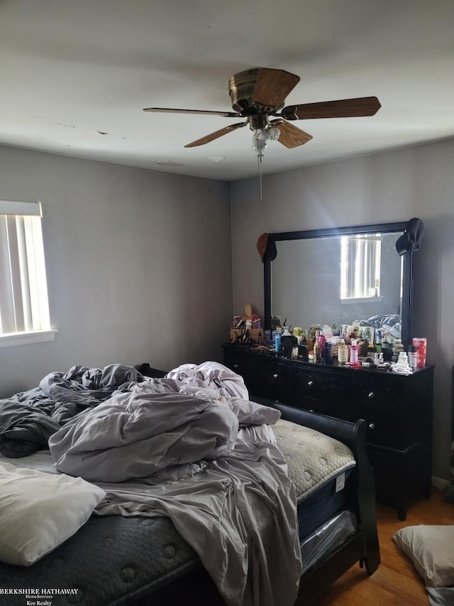 bedroom featuring ceiling fan and wood-type flooring