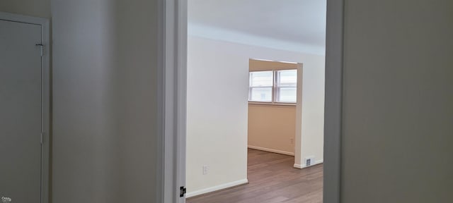 corridor featuring light hardwood / wood-style floors