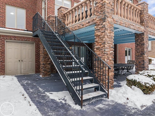 view of snow covered property entrance