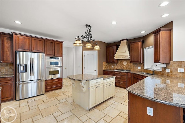 kitchen with sink, stainless steel appliances, tasteful backsplash, a kitchen island, and custom exhaust hood