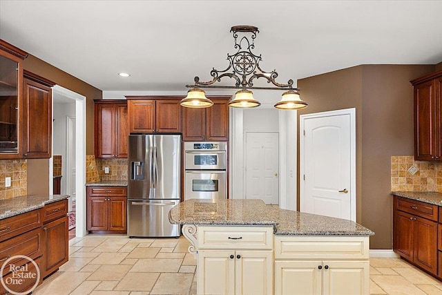 kitchen with tasteful backsplash, hanging light fixtures, a kitchen island, and stainless steel appliances