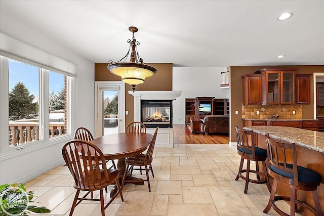 dining area with a multi sided fireplace