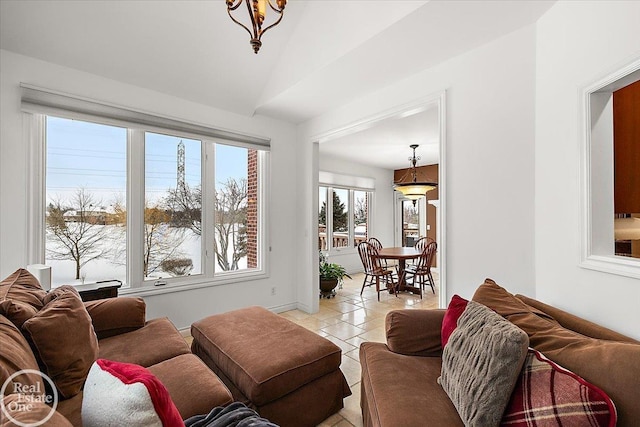 living room featuring vaulted ceiling and light tile patterned flooring