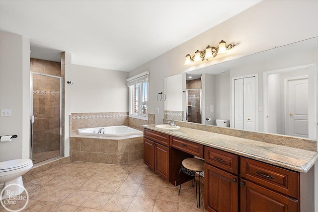 full bathroom featuring tile patterned flooring, vanity, toilet, and independent shower and bath