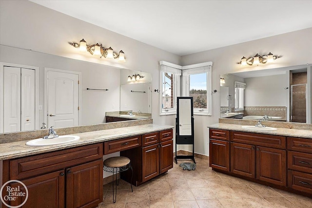 bathroom with tile patterned floors, separate shower and tub, and vanity