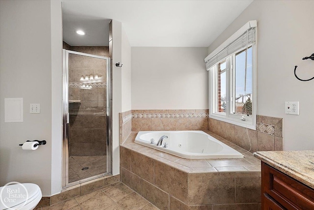 full bathroom featuring separate shower and tub, vanity, and toilet