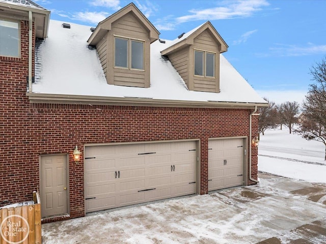 view of snow covered garage