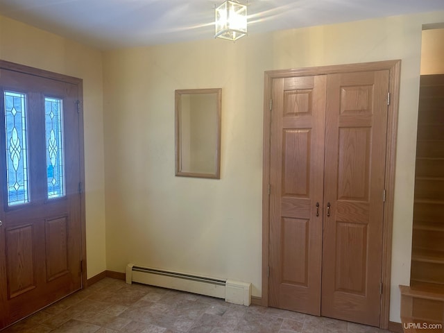 entrance foyer featuring a baseboard heating unit