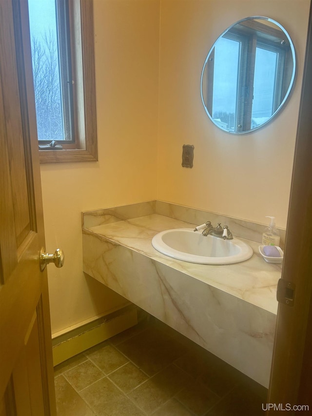 bathroom with tile patterned flooring and sink