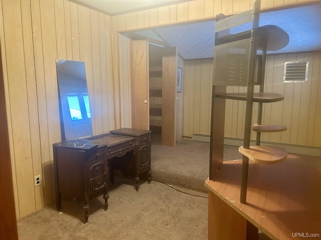 carpeted home office with wooden walls