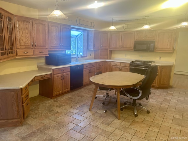 kitchen with black appliances, hanging light fixtures, and sink