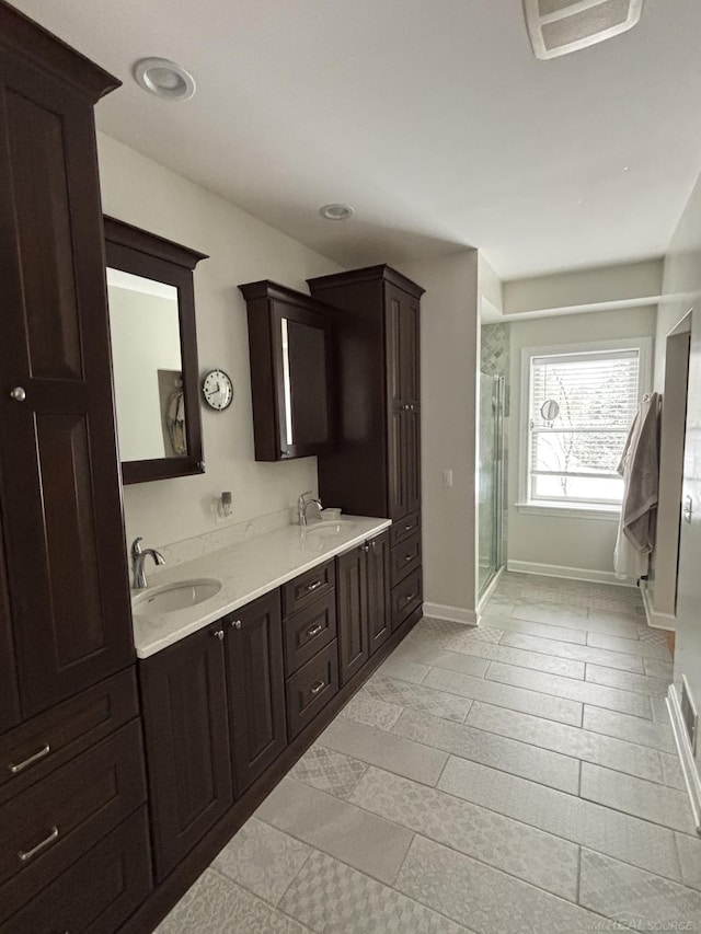 bathroom with vanity and an enclosed shower